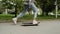 Trendy young girl learning to skateboard