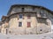 TRENTO, ITALY - JUN, 1 2019: front view of a curved house built on a strret corner