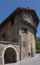 TRENTO, ITALY - JUN, 1 2019: side view of a curved house built on a strret corner