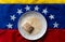 `tres leches` cake on top of venezuelan flag, a traditional venezuelan dessert with milk and cinnamon powder, symbol of latin a