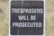 Trespassers will be prosecuted sign