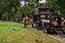 Tress service trucks line the streets removing fallen trees after a severe wind storm passed through this town