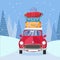 Treveling by red car with pile of luggage bags on roof on the road by the snowy forest. Winter tourism, travel, trip. Flat cartoon