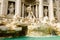 Trevi Fountain, left side view. Beautiful baroque Fontana di Trevi by Nicola Salvi