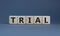 Trial symbol. The word `trial` on wooden cubes on beautiful grey background, copy space. Business and trial concept