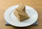 Triangle Coffee Chiffon Cake on White Dish