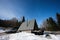 Triangle country tiny cabin house and suv car with roof rack in mountains. Soul weekends