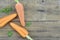 Triangle made of tasty ripe carrots on wooden rustic