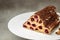 triangular cake with cherries on plate. Food recipe background. Close up