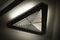 Triangular light source. Lamp in interior. Designer light. Architecture details