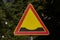 A triangular road sign of work in progress indicating the presence of bumps
