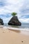 Triangular rock in the ocean on Bingin Beach, Bali - Indonesia