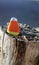 Triangular rock painted to look like candy corn