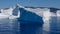 Triangular shaped iceberg with abrupt sides on a calm sea