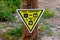 Triangular yellow trail courtesy sign