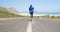 Triathlete man jogging in the countryside road