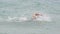 Triathlete man swimming freestyle crawl in ocean - Triathlon swimmer