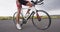 Triathlon bike closeup - triathlon bicycle with triathlete cycling shoes