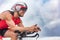 Triathlon biking man cyclist portrait riding bike. Male triathlete cycling on triathlon bike. Fit man professional