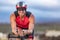 Triathlon biking man cyclist portrait riding bike. Male triathlete cycling on triathlon bike. Fit man professional