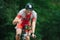 Triathon biking cyclist triathlete riding racing bike during ironman competition