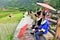 tribe with umbrellas and traditional costumes in china