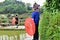 tribe with umbrellas and traditional costumes in china