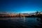 Triborough bridge over the reflective river and buildings , New York