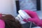 Trichologist diagnostics woman patient hair uses computer trichoscopy in clinic.
