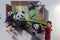 Trick art, painting, 3dlifelikeyoung boy takes part in the picture, indoors fun happy panda bbear