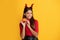 trick or treat. teen girl on yellow background. celebrate autumn party holiday.