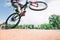 Tricks on the bike. young man jumps on a mountain bike. Cycling Sports Concept