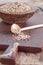 Tricolor quinoa in wooden bowl, wooden spoon