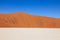 Tricolored graphical desert with dunes, salt pan, sky. Sossusvlei, Namibia