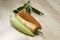 Tricolored Sweet Banana Peppers on a wooden cutting board