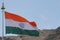 tricolour indian flag flying in the wind near india china border close to the doklam. happy republic day india