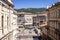 Trieste, Italy - September 2019: View of the piazza carlo goldoni from the scala dei giganti. Skyline, theater and university visi