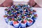 Trifle. A lot of trifles or cake in a blue glasses decorated with berries. Festive layered dessert in glass.