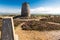 Trig point with derelict windmill, Parys Mountain.