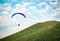 Trike with a parachute against the blue sky.