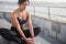 Trim young woman exercising by the sea side