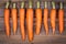 Trimmed carrots in a row