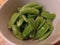 Trimmed sugar snap peas in a bowl