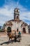 TRINIDAD, CUBA - FEB 8, 2016: Horse carriage rides in front of the ruin of Santa Ana church in the center of Trinida