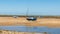 Trio of boats beached at Wells next the Sea