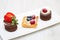 Trio of cakes with fruit
