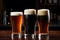 a trio of contrasting beer types: lager, stout, and ale