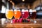 a trio of fruit-infused beers: orange, cherry, raspberry