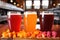 a trio of fruit-infused beers: orange, cherry, raspberry