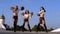 Trio girls cheerleaders with pompons dancing outdoors